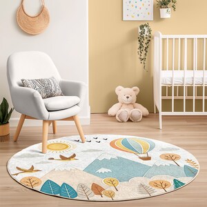 Non-slip round rug with high-quality digital print, showcasing serene mountains, clouds, and a sun for imaginative play areas