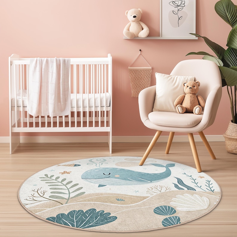 Underwater adventure themed round mat, displaying sea life and a spouting whale, for use in children's bedrooms or play spaces.