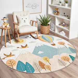 Hot air balloon and forest tree accents on a round mat, ideal for boho or modern children's room settings and safe for play