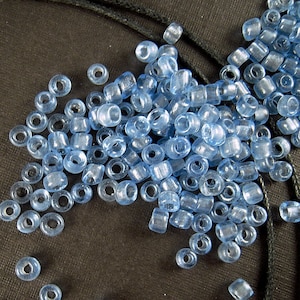 11-359, Miyuki 22g Pale Blue Lined Lt Topaz AB 11-359, Miyuki 22g Pale Blue Lined Lt Topaz AB