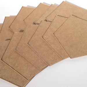 May include: A set of ten unfinished wooden hexagons, perfect for crafting projects. The hexagons are made of natural wood and have a smooth surface.