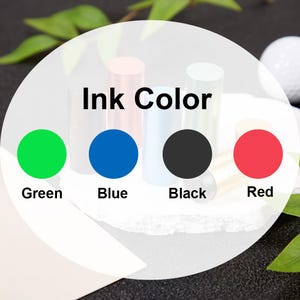 May include: Ink color samples in green, blue, black, and red. The text "Ink Color" is displayed above the samples.