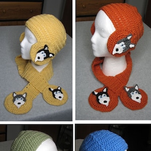 May include: Four crochet hat and scarf sets in yellow, orange, green, and blue. Each set features a hat with ear coverings and a matching scarf, all adorned with a husky dog face design.