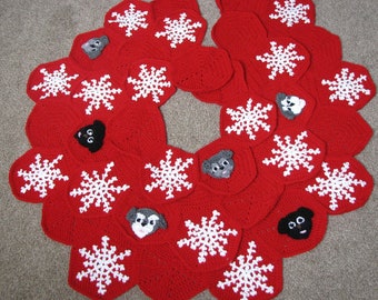 May include: A red crocheted Christmas tree skirt with white snowflake designs and gray dog appliques.
