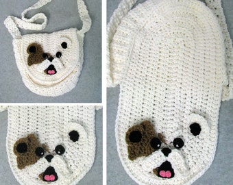 May include: A white crocheted crossbody bag with a bulldog face design. The bag has brown ears, black eyes, and a pink nose.