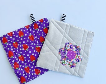 Purple hexie flower potholders with strawberry backing