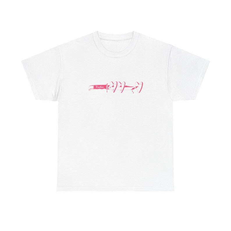 May include: White t-shirt featuring a pink graphic. The design includes the word "Yadie" and a series of stylized symbols. The shirt is made of a soft material and has a classic crew neck.