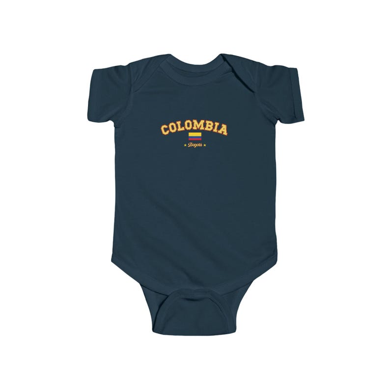 May include: A navy blue baby grow with the word "COLOMBIA" in yellow text with a small Colombian flag and the word "Bogota" in red text.