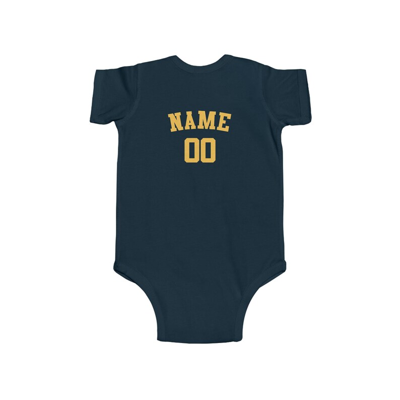 May include: A navy blue baby bodysuit with a gold "NAME 00" graphic on the back.