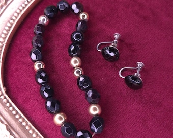 Plastic Faceted Black Onyx with goldtone Beads