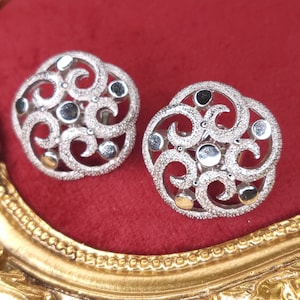 Textured silver tone Crown trifari floral clip on earrings