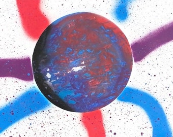 Handmade spray painted celestial image of blue-red planet and colorful stripes, ready for spray painting on the wall.