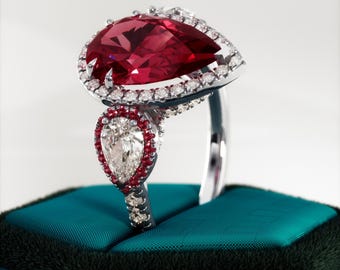 3 Carat Pear Lab Grown Ruby Ring: Diamond Halo, Three Stone Pavé