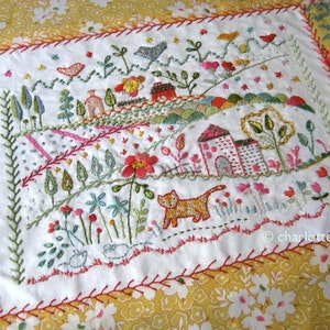 m. amérique, le chat dans un pré échantillonneur de couture