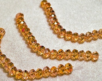 Perles rondelles en cristal à facettes champagne rose