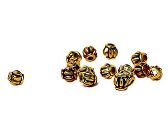 Golden Pixies- pewter spacer beads- antiqued gold spacers- designer beads- tiny spacers- ethnic style beads- vintage style beads- gold beads