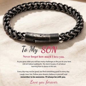 May include: A dark grey, distressed metal wheat chain bracelet with a rectangular clasp. Below the bracelet, text reads: To My SON, Never forget how much I love you. As you grow older you will face many challenges in life just do your best. Love you forever.