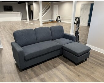 Black three-seat, L-shaped, upholstered sectional sofa, apartments, dorm rooms, and bonus rooms