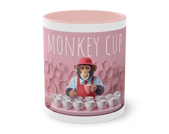 Taza en tonos rosas con la ilustración de un simpático chimpancé.