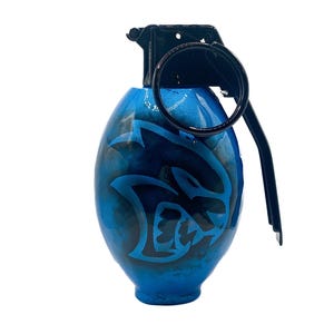 May include: A blue grenade-shaped ornament with a black handle and a black and white Dodge Challenger logo painted on the front.