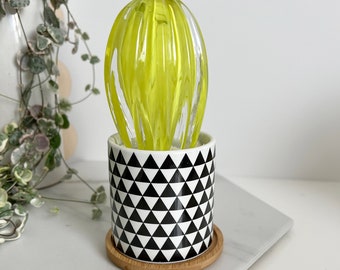 Hand-blown lime green glass catcus in geometric triangle pot