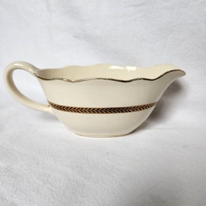 Old sauceboat in opaque porcelain from the French manufacturer Digoin Sarreguemines. Turenne model. image 1