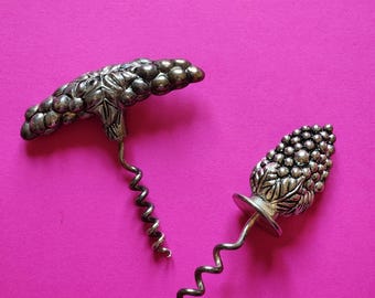 2 vintage corkscrews shaped like bunches of grapes