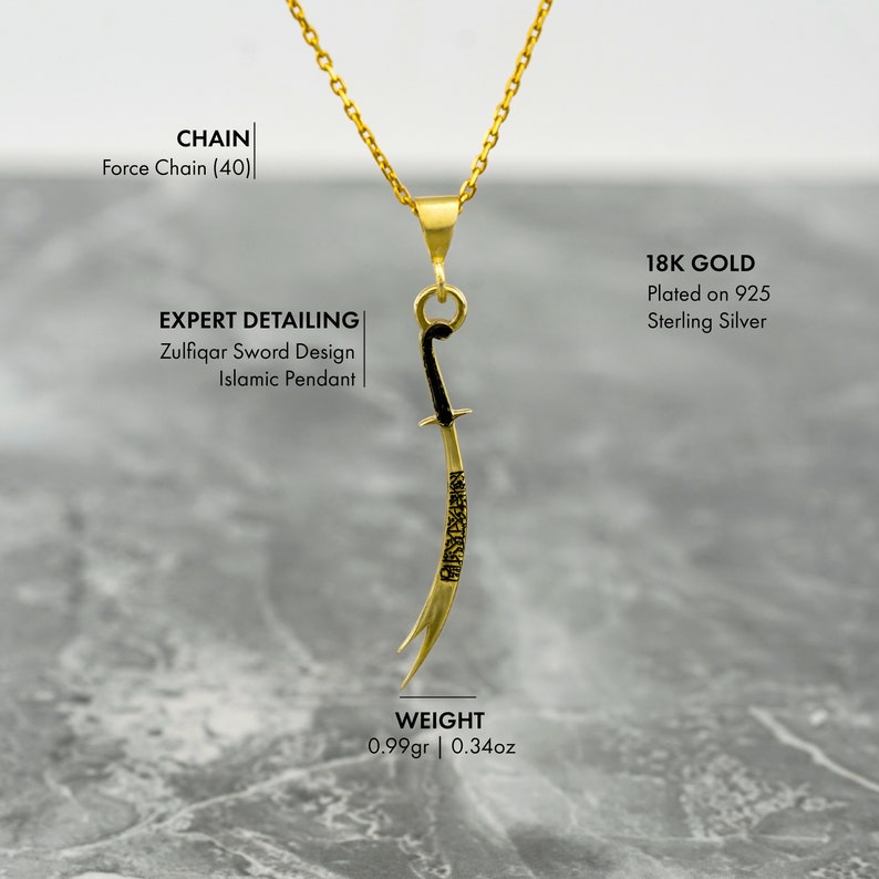 May include: A gold pendant necklace featuring a stylized sword design with black accents. The pendant is made of 18k gold plated on 925 sterling silver and weighs 0.99 grams or 0.34 ounces. The necklace is on a gold chain.