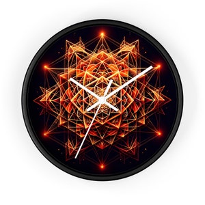 May include: Circular wall clock with a black frame. The clock face displays a geometric pattern in orange and gold hues on a dark backdrop. White clock hands show the time.