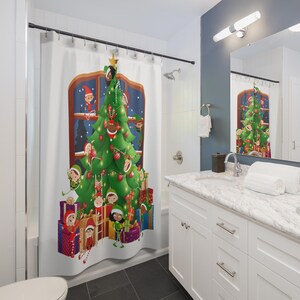 May include: A white shower curtain featuring a Christmas tree design. The tree is decorated with ornaments and lights, and surrounded by elves and wrapped gifts. The design is set against a window with a snowy night scene.