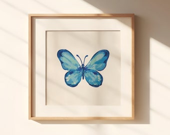 May include: A framed print of a blue watercolor butterfly with a white background.