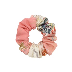 Elevate Your Hairstyle with Vintage Silk Elegance
Add a touch of Kawaii charm to your daily look with this simple, handmade scrunchie. Crafted from authentic vintage kimono silk, it features a delicate pink floral pattern that blends traditional Japanese artistry with modern sustainable style.

Material: 100% Upcycled Silk

Style: Gentle on hair, reduces breakage

Design: Unique floral motifs

Perfect for eco-conscious fashion lovers looking for a one-of-a-kind, sustainable accessory.