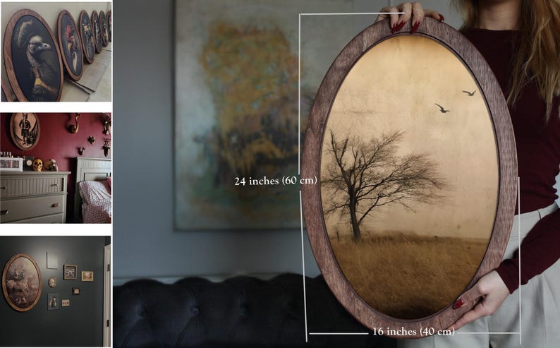 May include: A framed oval print of a lone tree in a field with a muted brown and gold colour scheme. The print is 40 cm by 60 cm and is framed in a dark wood frame.