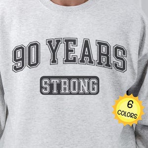 90 YEARS STRONG 90th Birthday Shirt, Anniversary Event Pullover Crewneck Varsity Sweatshirt, Unique Gift for Women, Men, Him, Her, Mom, Dad