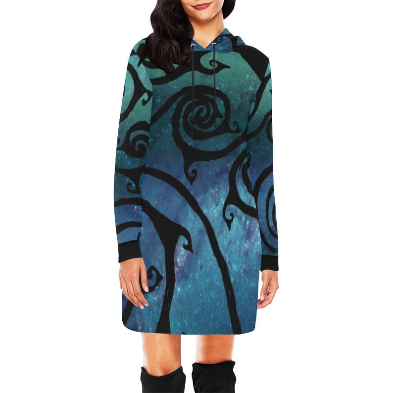 May include: A long-sleeved hooded dress with a blue and green galaxy print and black swirling designs.