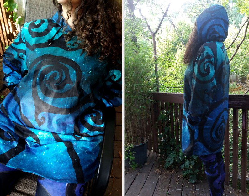 May include: A blue and black hooded sweatshirt with a swirling pattern. The sweatshirt is made of a soft, comfortable fabric and has a relaxed fit.