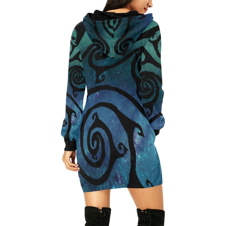 May include: A blue and green hooded dress with a black swirling pattern. The dress has long sleeves and a fitted silhouette.