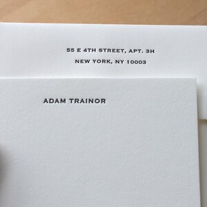 White card with white envelopes, Close‑up of deep letterpress impression on thick cotton paper.
