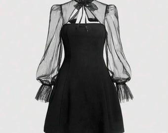 Black turtleneck long-sleeve dress, with contrast mesh flare sleeves and tie neck, sheer.