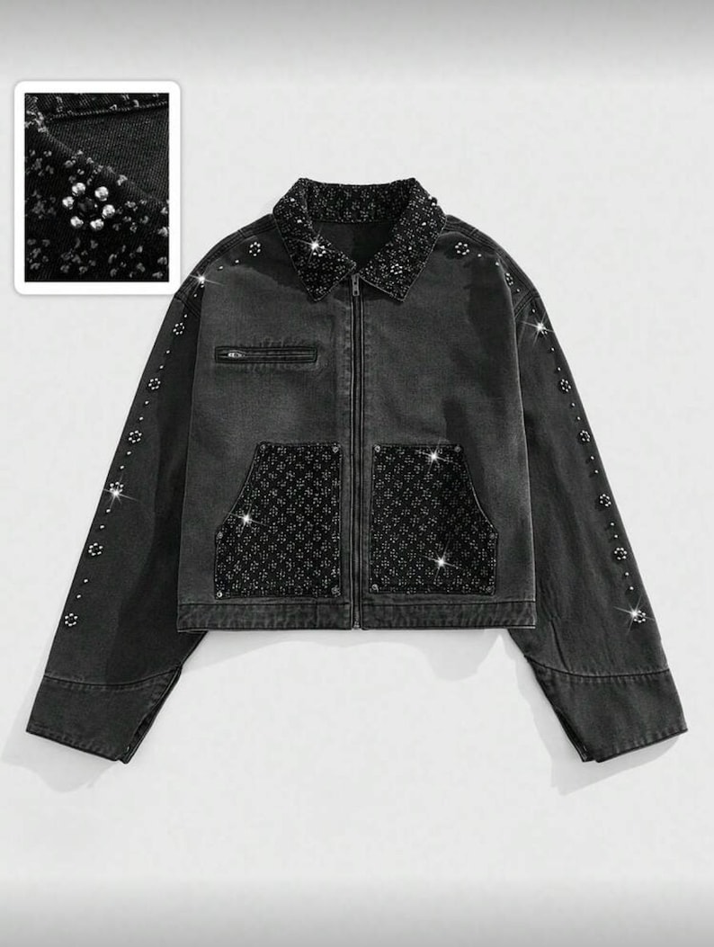 May include: A black denim jacket with a collared neckline, zip-up front, and two front pockets. The collar, pockets, and sleeves are embellished with sparkling rhinestones. The jacket has a cropped fit and long sleeves.