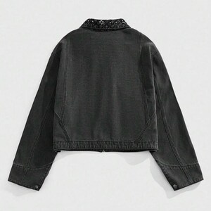 May include: A dark gray denim jacket with a decorative collar. The jacket has long sleeves, a button closure on the cuffs, and a zipper closure down the front. The back of the jacket is visible, showing the seams and construction details.