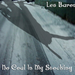 May include: A snowy road with a shadow of two people in the shape of a peace sign. The text "Les Barons" and "No Coal In My Stocking" are written in a decorative font.
