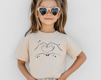 Heart Hands T-Shirt, Music Lover Gift Tee, Hand Heart Graphic Tee ,Cute Heart Gesture Shirt, Fan Gift, Matching Heart Design, Love Shirt.