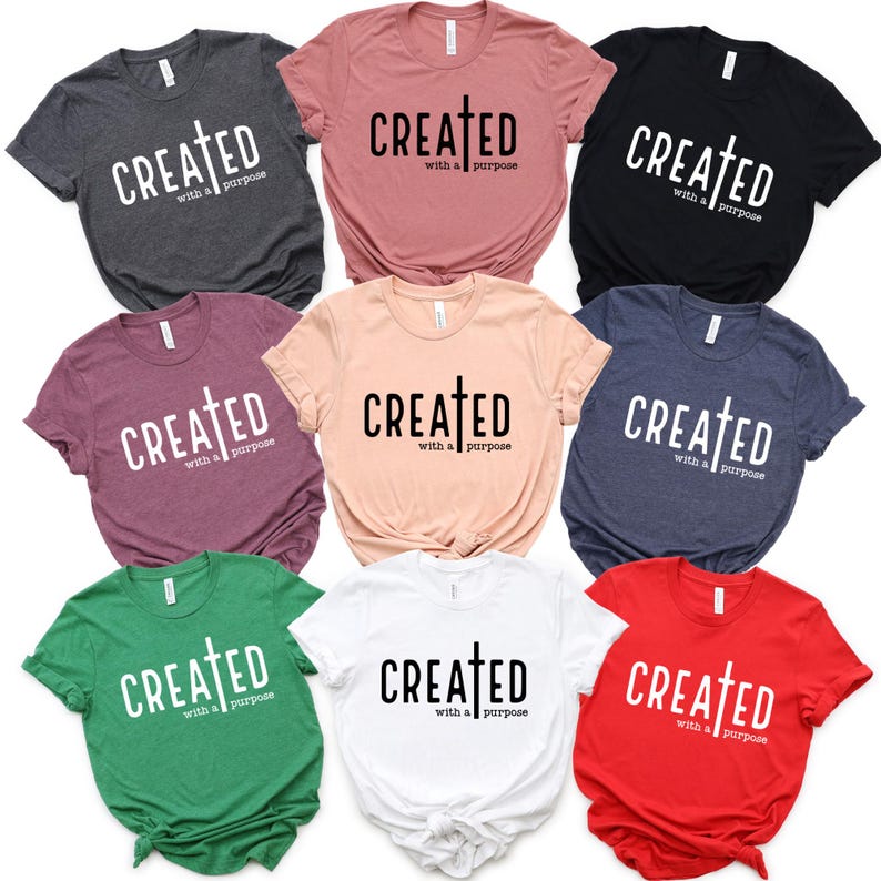 May include: Nine t-shirts in different colors with the text "CREATED with a purpose" and a cross symbol.