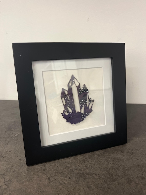 Amethyst crystal formations reimagined as circuit board pathways in a compact framed original — a genuinely unexpected mashup of geology and tech art.