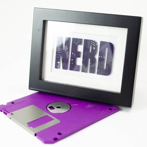 mini circuit board art spelling out the word nerd