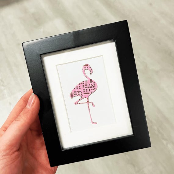 A flamingo rendered entirely in salvaged circuit board traces — where PCB geek meets tropical kitsch in genuinely striking miniature wall art.