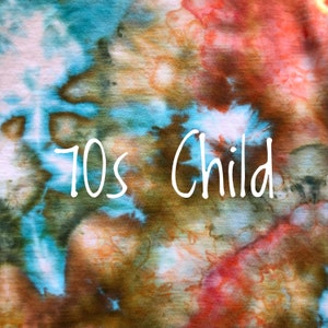 May include: A tie-dye fabric background with the text "70s Child" in white.