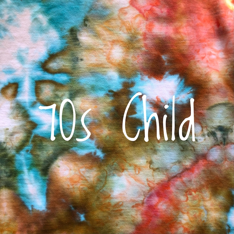 May include: A tie-dye fabric background with the text "70s Child" in white.