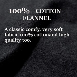 May include: Close-up of a black flannel fabric with the text "100% COTTON FLANNEL" and "A classic comfy, very soft fabric 100% cottonand high quality too."